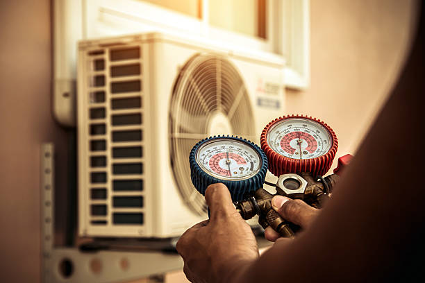 Professional Air Conditioning Service technician working in Alpha, OH